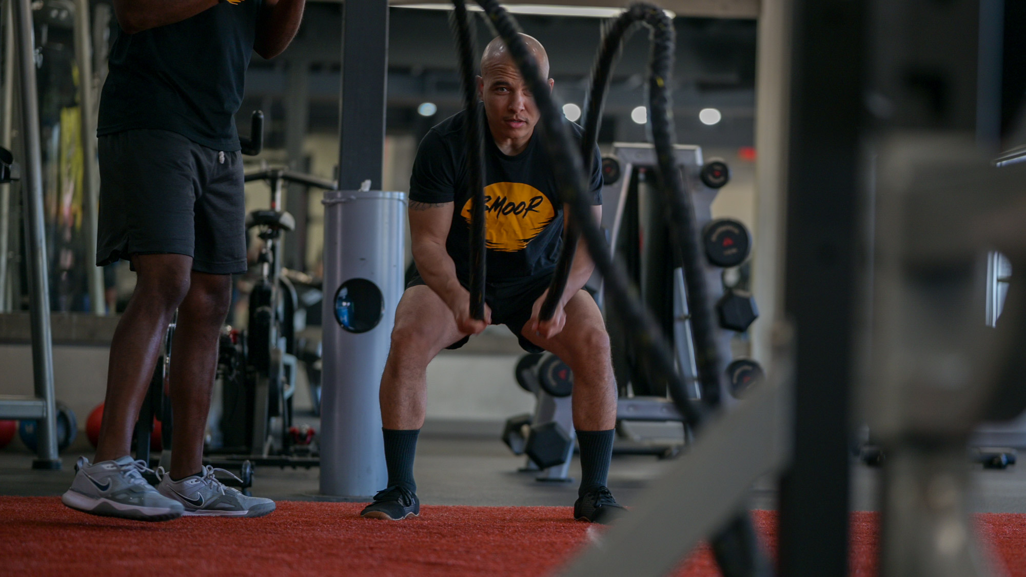 Man doing ropes at the gym