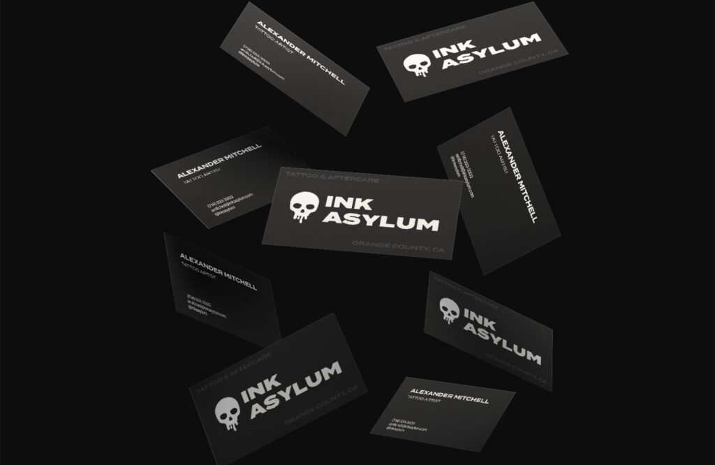 Floating business cards floating on a black background.